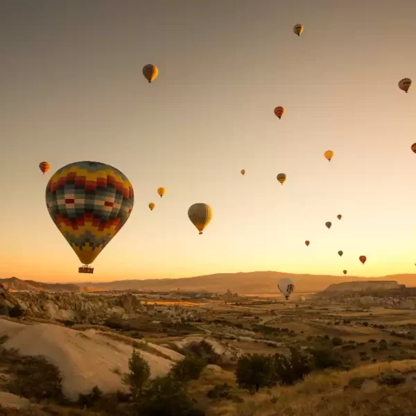 People Enjoying Hot Air Balloon ride in Marrakech on a sunset