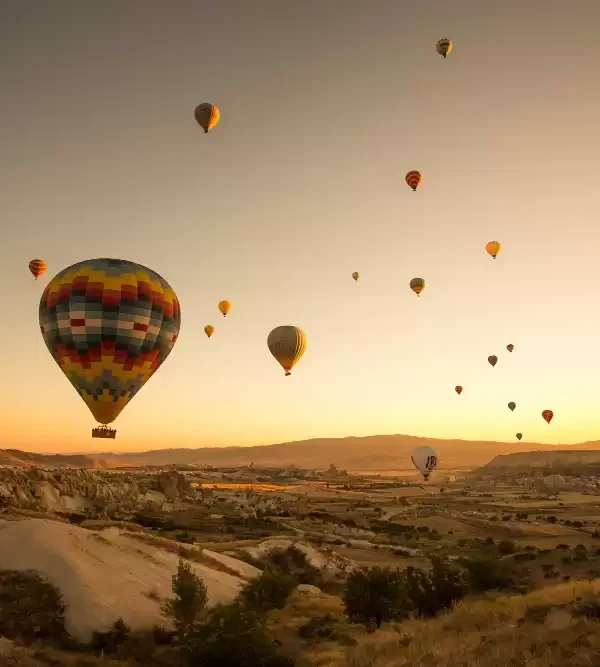 People Enjoying Hot Air Balloon ride in Marrakech on a sunset