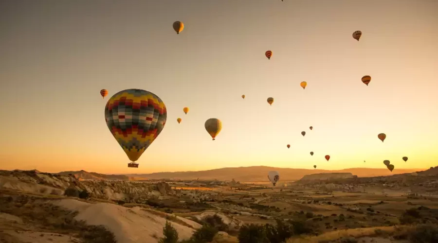 People Enjoying Hot Air Balloon ride in Marrakech on a sunset