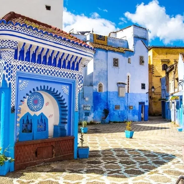 Scenic view of Chefchaouen, Morocco, showcasing its iconic blue buildings, ideal for travel in spring or fall. with our Morocco Tours