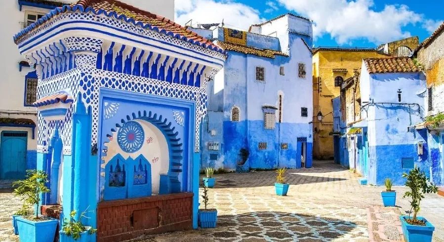 Scenic view of Chefchaouen, Morocco, showcasing its iconic blue buildings, ideal for travel in spring or fall. with our Morocco Tours