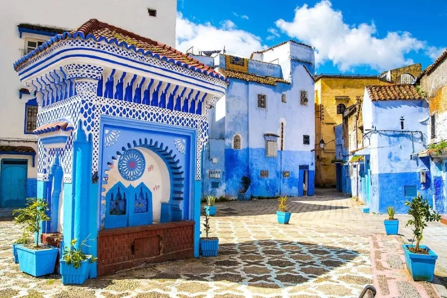 Scenic view of Chefchaouen, Morocco, showcasing its iconic blue buildings, ideal for travel in spring or fall. with our Morocco Tours