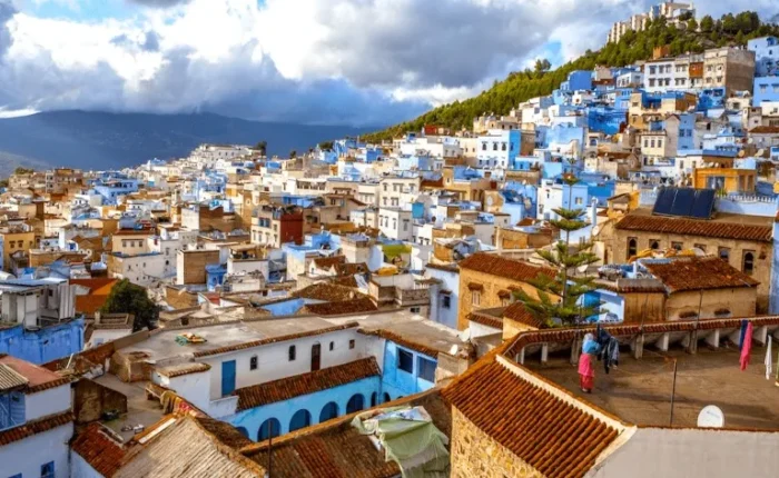 Scenic view of Chefchaouen, Morocco, showcasing its iconic blue buildings and mountainous backdrop, ideal for Morocco tours.