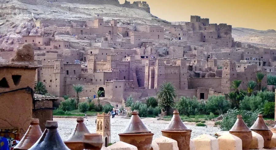 A panoramic view of Morocco's cityscape from a hilltop, showcasing the vibrant architecture and landscape.