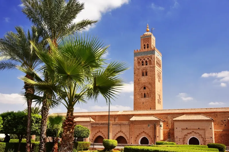 The iconic mosque in Marrakech, Morocco travel guide, showcasing intricate architecture and vibrant surroundings.
