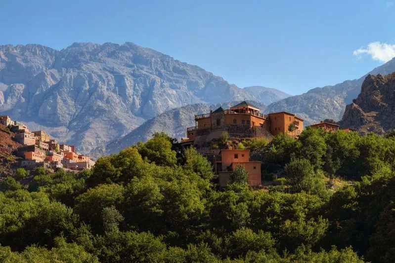 Scenic view of the village of Atlas nestled in the majestic Atlas Mountains, inviting visitors to explore its beauty.