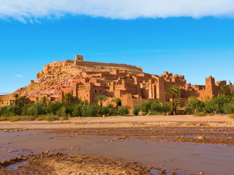 City in Morocco situated along the riverbank, showcasing its scenic beauty for travelers on a tour. 