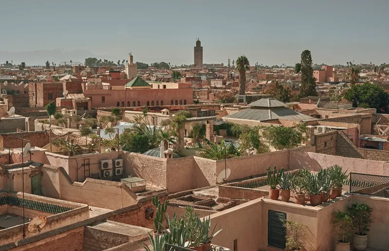 Rooftops of an old Moroccan city, showcasing the unique architecture of Marrakech.
