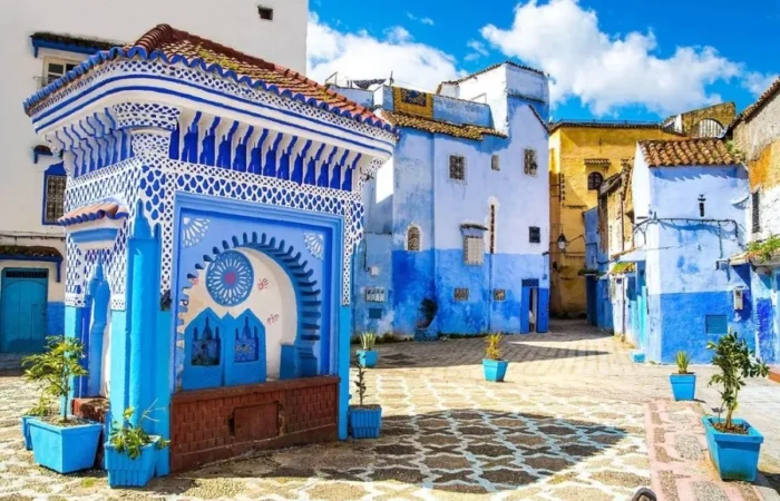 Scenic view of Chefchaouen, Morocco, known for its blue buildings, ideal for visiting in spring or fall.