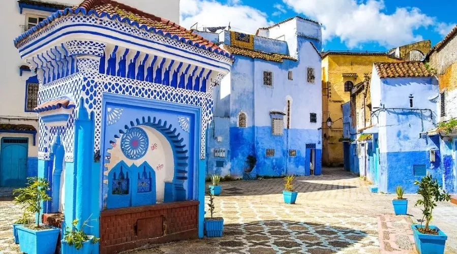 Scenic view of Chefchaouen, Morocco, known for its blue buildings, ideal for visiting in spring or fall.
