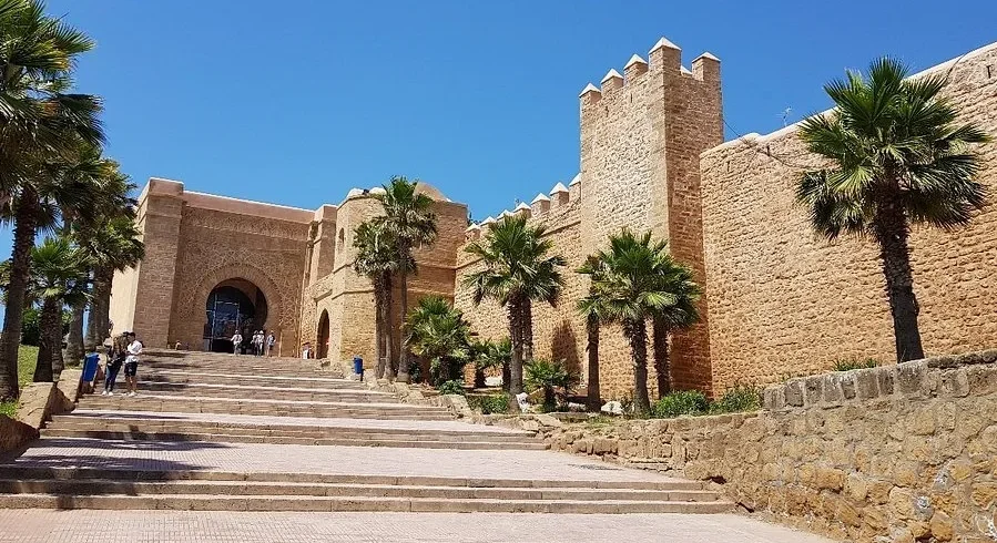 Steps leading to the castle entrance in Rabat, Morocco, showcasing historical architecture and inviting visitors.