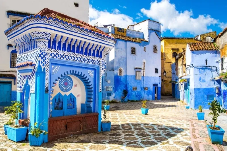 Scenic view of Chefchaouen, Morocco, showcasing its iconic blue buildings and vibrant streets, ideal for tours.