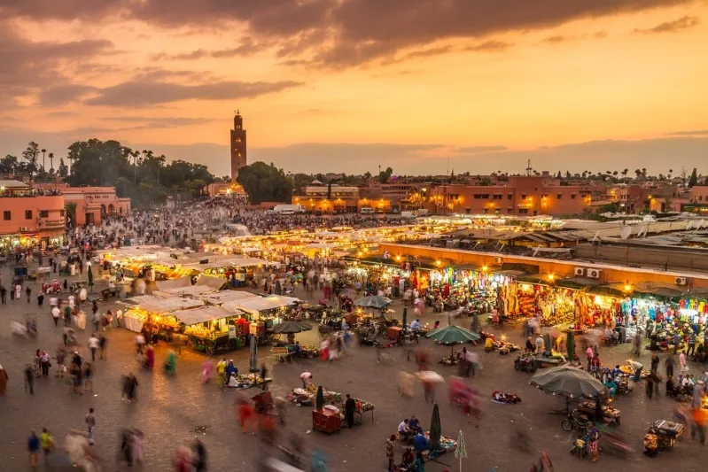 Sunset over Marrakech, showcasing vibrant colors and the city's iconic architecture, part of a 10-day Morocco itinerary.