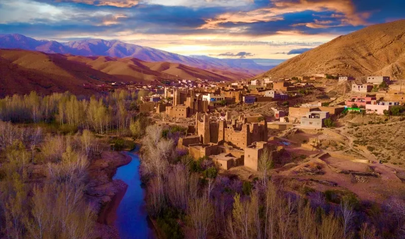 Scenic view of the village of Atlas in Morocco, showcasing its unique architecture and surrounding landscapes.
