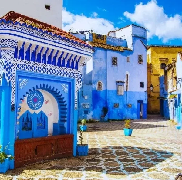 Scenic view of Chefchaouen, Morocco, showcasing its iconic blue buildings and mountainous backdrop for a 7-day itinerary.