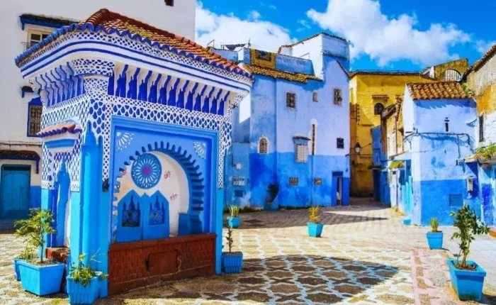 Scenic view of Chefchaouen, Morocco, showcasing its iconic blue buildings and mountainous backdrop for a 7-day itinerary.