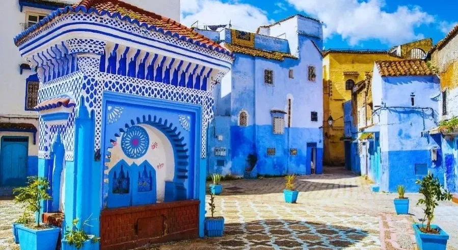 Scenic view of Chefchaouen, Morocco, showcasing its iconic blue buildings and mountainous backdrop for a 7-day itinerary.