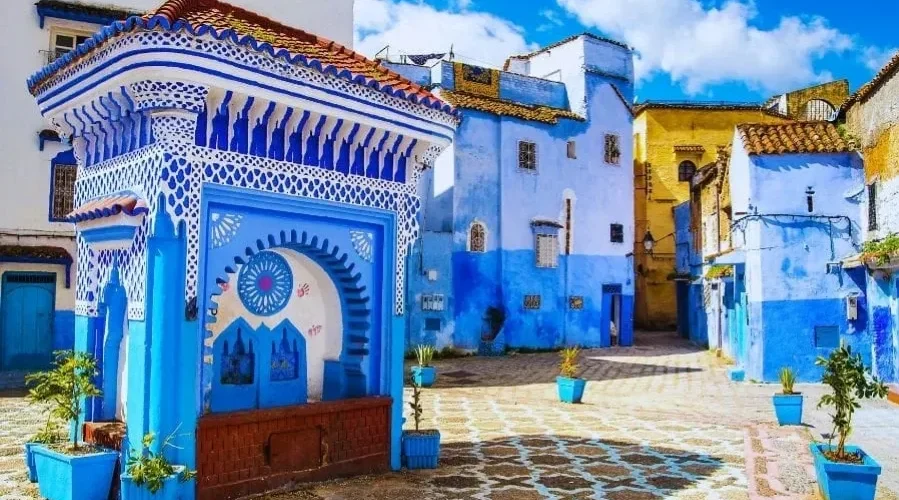 Scenic view of Chefchaouen, Morocco, showcasing its iconic blue buildings and mountainous backdrop for a 7-day itinerary.