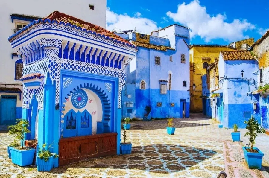Scenic view of Chefchaouen, Morocco, showcasing its iconic blue buildings and mountainous backdrop for a 7-day itinerary.