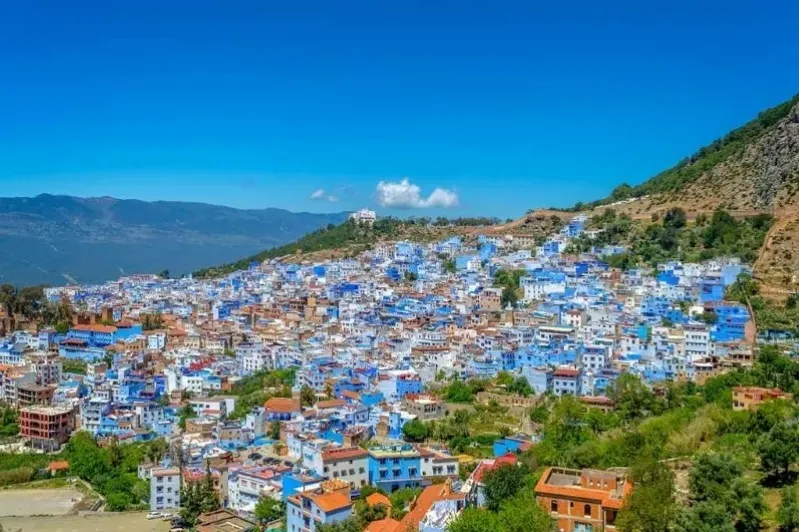 Scenic view of Chefchaouen, Morocco, showcasing its iconic blue buildings, part of the Fes to Marrakech Desert Tour.