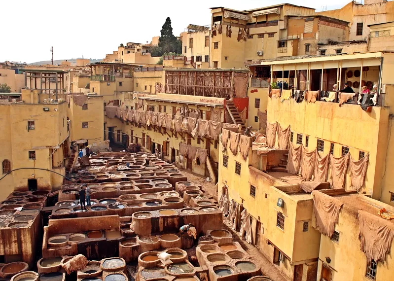 Aerial view of a Moroccan cityscape filled with colorful pots and pans, highlighting the vibrant culture of Morocco's essential cities.
