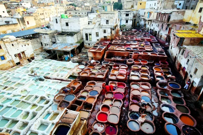 Colorful pots line the streets of Casablanca, showcasing the vibrant culture and artistry of Morocco's city life.