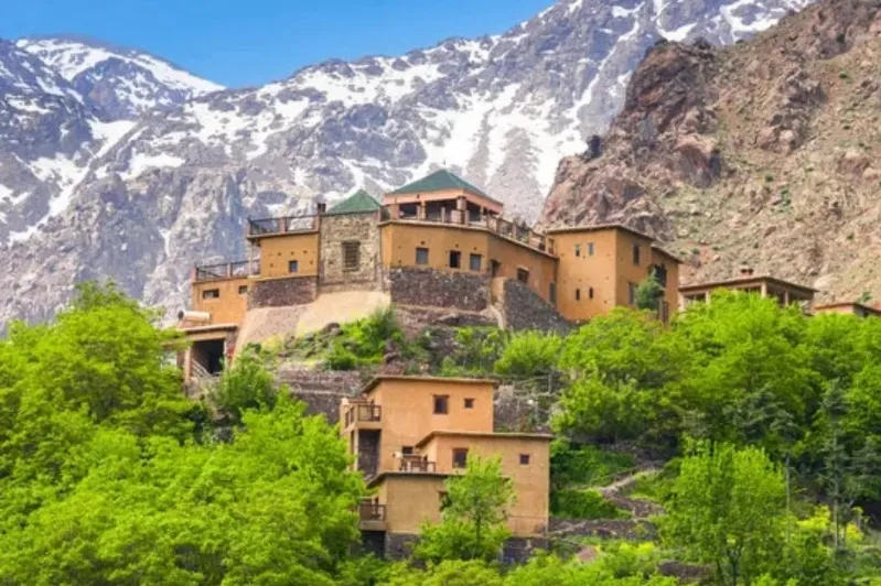 Scenic view of the Atlas Mountains showcasing picturesque villages, ideal for luxury private tours in Morocco. 
