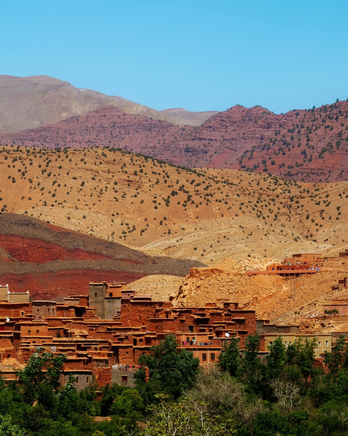 Terraced fields and red earth villages along the Ounila Valley road