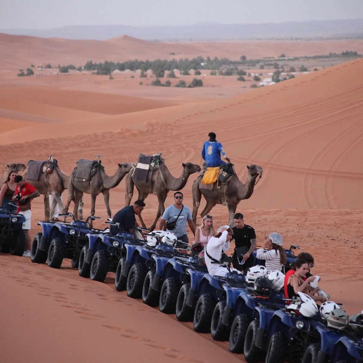 Photo stop during a Merzouga desert excursion with the Erg Chebbi dunes behind