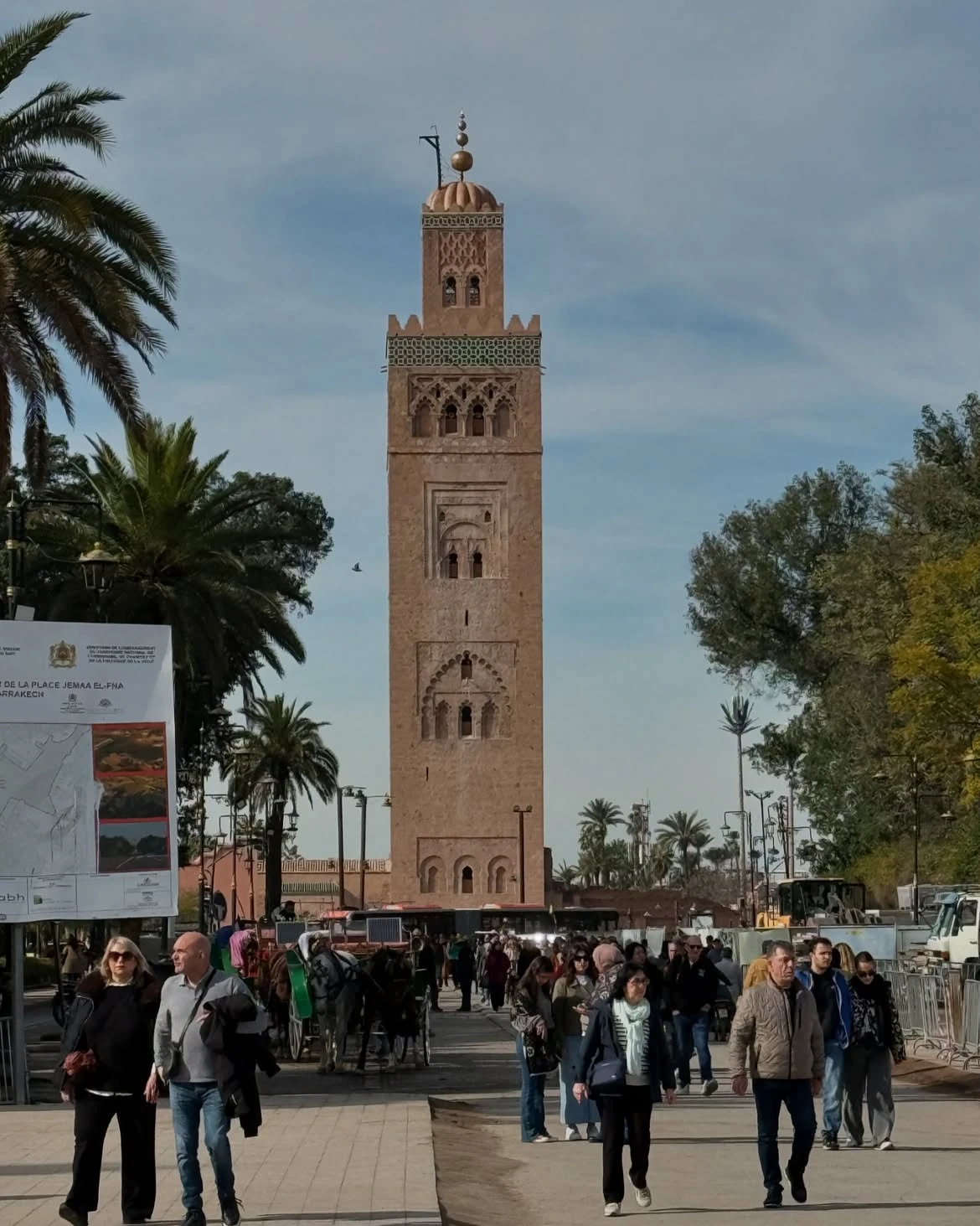 Self-guided tourists exploring Jemaa el-Fnaa square in Marrakech
