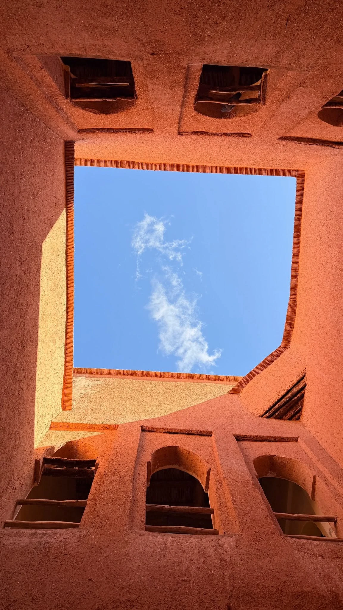 Inner courtyard of Taourirt Kasbah with earthen walls and open sky