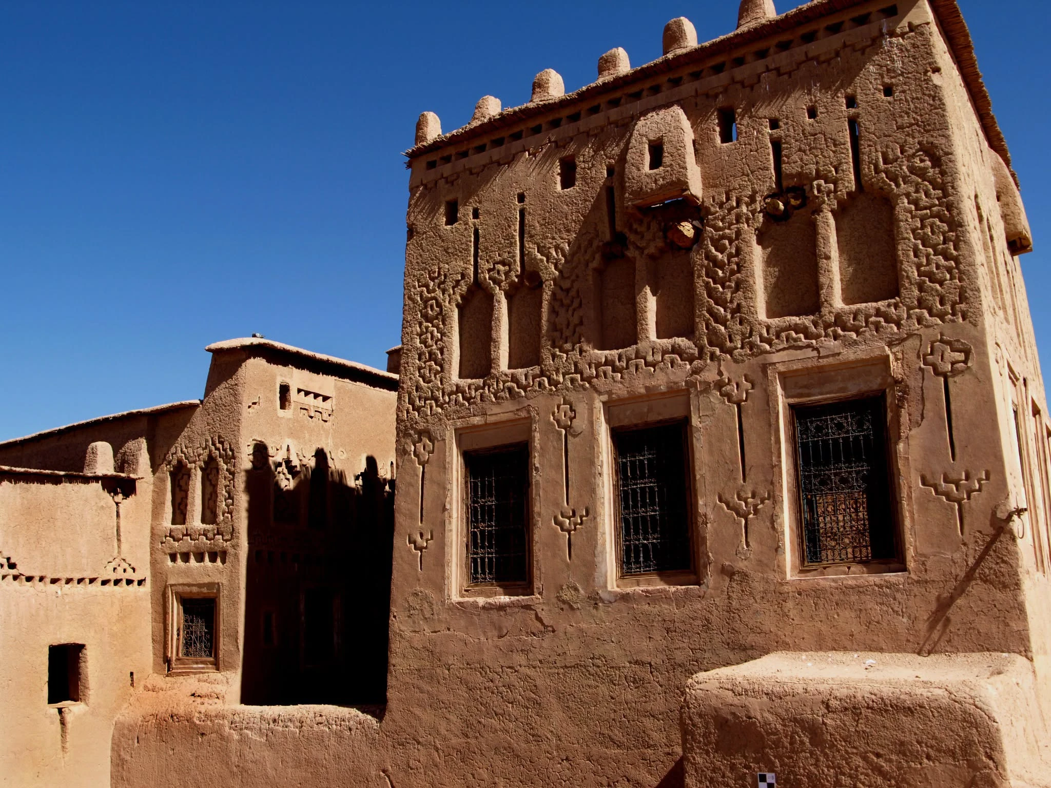 Mud brick walls of Taourirt Kasbah with visible construction layers