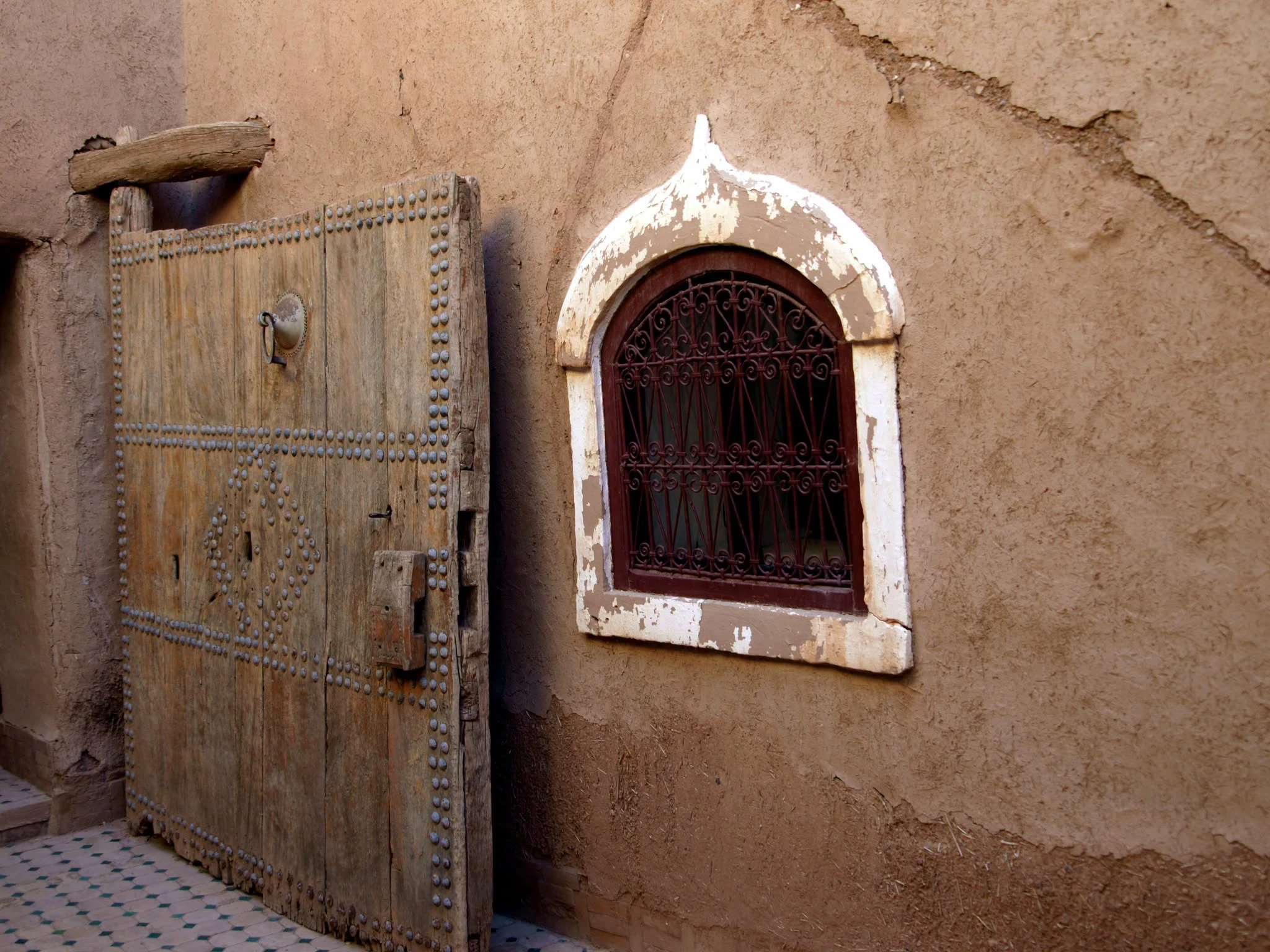 Old studded wooden door inside Taourirt Kasbah in Ouarzazate