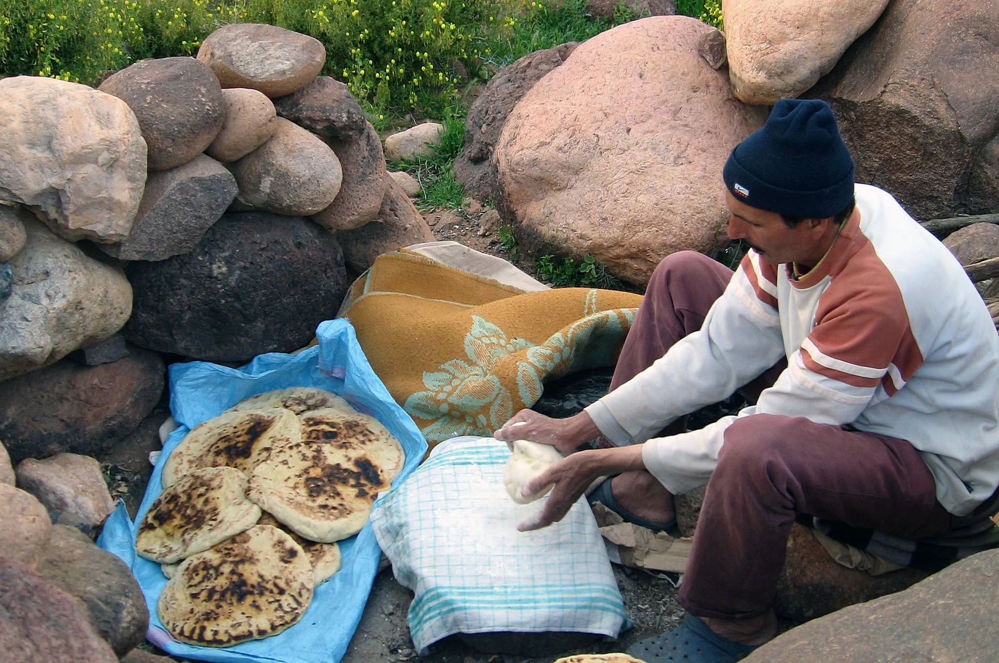 Traditional bread baked in the sand as part of nomadic life in Morocco